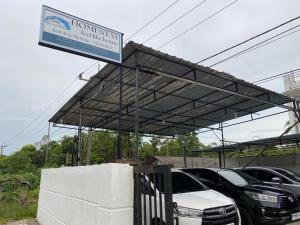 a car dealership with cars parked in a parking lot at BMC HomeStay in Sebungsungai