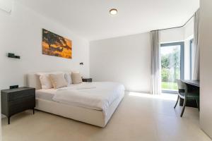 Ένα ή περισσότερα κρεβάτια σε δωμάτιο στο Villa Fiducia - Modern villa close to Poreč +36 φωτογραφίες