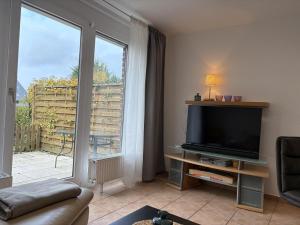 Μια τηλεόραση ή/και κέντρο ψυχαγωγίας στο Ferienhaus "MeerZeit"