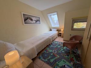 Ένα ή περισσότερα κρεβάτια σε δωμάτιο στο Ferienhaus "MeerZeit"