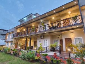 an apartment building with a balcony and plants at 88 GREEN FORT EDAPALLy in Ernakulam