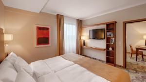TV a/nebo společenská místnost v ubytování Hotel Oranien Wiesbaden