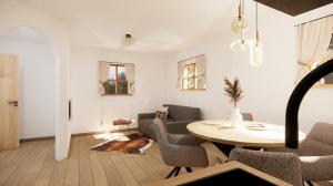 a living room with a table and a couch at Alpen Lodge Kirchberg in Kirchberg in Tirol