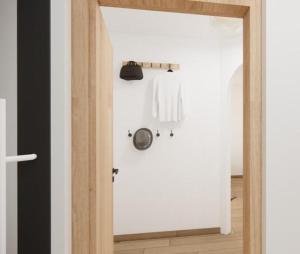 a bathroom with a white door and a white shirt at Alpen Lodge Kirchberg in Kirchberg in Tirol +23 photos