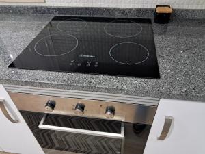 a stove top oven sitting inside of a kitchen at Casa do Sardão in Sardoal
