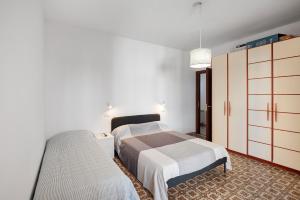 Ένα ή περισσότερα κρεβάτια σε δωμάτιο στο La Rosa Dei Venti