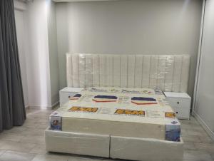 En eller flere senge i et værelse på Polana Plaza