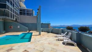 a swimming pool on the roof of a building at Nautica 009 Studio Flat in Mossel Bay