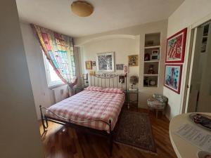 a bedroom with a bed and a window at All'ingresso delle antiche mura della città in San Marino