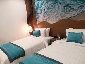 Una cama o camas en una habitación de Jomtien Beach Market Place