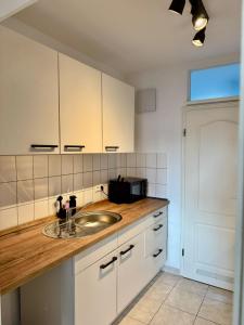 Kuchyň nebo kuchyňský kout v ubytování Design City Apartment Casper am Yachthafen + 14 fotografií