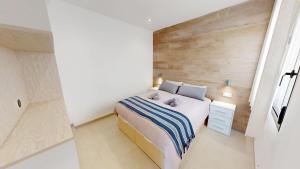 En eller flere senge i et værelse på Holidoo Travel - Casa Cielo Azul