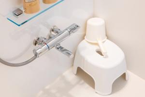 a bathroom with a white toilet and a sink at Villetta Imari Ekimae III Room 104 - Vacation STAY 19028 in Imari +60 photos