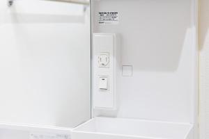 a close up of a control panel of an appliance at Villetta Imari Ekimae III Room 103 - Vacation STAY 19026 in Imari +64 photos