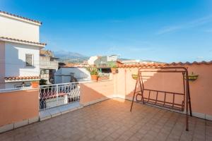 a balcony with a view of a city at A Casa Mia in Riposto