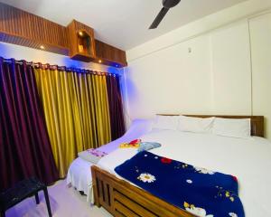 Ένα ή περισσότερα κρεβάτια σε δωμάτιο στο Flat in Guruvayur- Sooryamadhavam Apartments- Family only