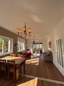 a dining room with a table and chairs at Vista Bella - Villa Giulia in Porto Valtravaglia