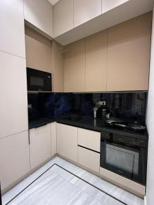 Η κουζίνα ή μικρή κουζίνα στο Cozy Nest Apartments