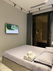 Ένα ή περισσότερα κρεβάτια σε δωμάτιο στο Cozy Nest Apartments