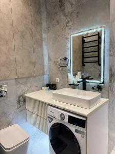 Ένα μπάνιο στο Cozy Nest Apartments