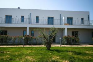 a building with balconies on the side of it at Acquaria Case Vacanze in Marsala