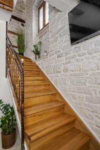 a staircase in a house with a stone wall at Villa Istria Mar in Pazin