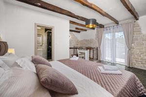 a bedroom with a large bed in a room at Villa Istria Mar in Pazin