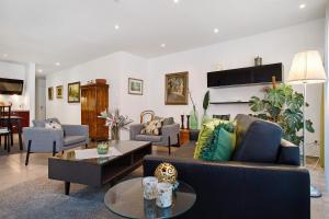 a living room with couches and a fireplace at Kapps Haus in Langenargen