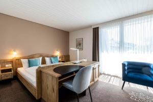 Postel nebo postele na pokoji v ubytování Hotel in den Herrnwiesen