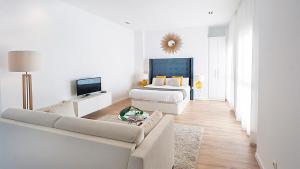 Televízia a/alebo spoločenská miestnosť v ubytovaní iloftmalaga Studio Apartments