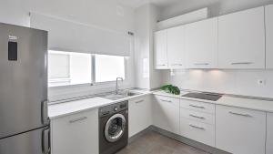 Kuchyňa alebo kuchynka v ubytovaní iloftmalaga Studio Apartments