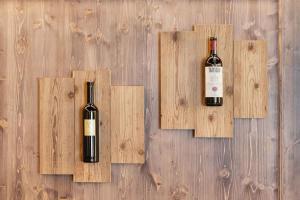 two bottles of wine sitting on wooden panels at St Moritz Square 2 bedr Alpin Elegance in St. Moritz +18 photos