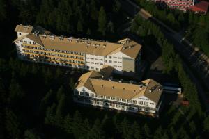 an overhead view of a large building with trees at Jawor in Polańczyk