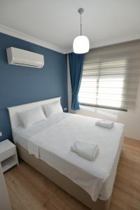 Katil atau katil-katil dalam bilik di Arti̇m Apart Hotel