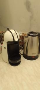 a toaster and a tea kettle on a counter at "HOUSE OF LELLA 2" appartamento 1 camera da letto - M1 METRO ROSSA in Milan