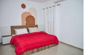 Ένα ή περισσότερα κρεβάτια σε δωμάτιο στο Residence Pedro Marcory Zone4, Abidjan