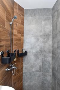 a bathroom with a shower and a sink at Industrial Hostel Vila Jovana in Odžaci