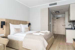 Ένα ή περισσότερα κρεβάτια σε δωμάτιο στο Your Holidays Infinity A233