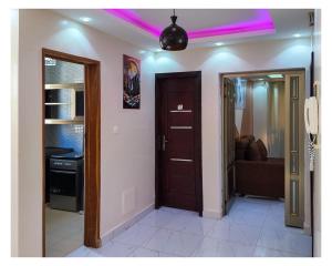 a room with a door and a living room at Hotel Residence Ami Bamba in Sali Nianiaral