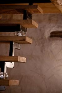 a set of wooden shelves in a room at la stalla di mario in Perondo