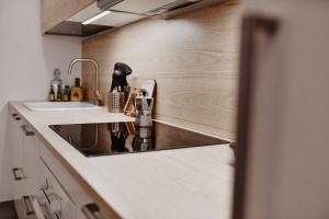 a kitchen with a sink and a counter top at Suite Grottabeach a due passi dal mare in Grottammare +17 photos