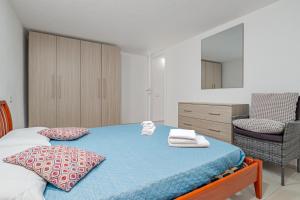 Postel nebo postele na pokoji v ubytování Cormorani appartamento N 5