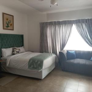 Ένα ή περισσότερα κρεβάτια σε δωμάτιο στο Mthembu Executive Accomodation