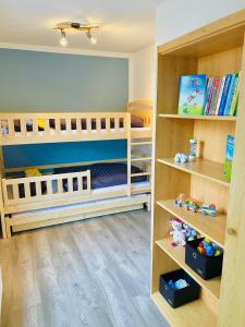 Postel nebo postele na pokoji v ubytování Lüttje Deichvilla XL