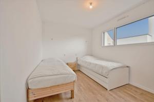 Ένα ή περισσότερα κρεβάτια σε δωμάτιο στο Villa pour 9 - Piscine chauffée - Jacuzzi