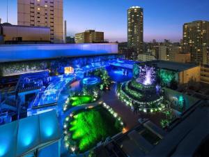 a view of a city skyline at night at HOTEL LUANA in IKEBUKURO HIGASHINAGASAKI in Tokyo