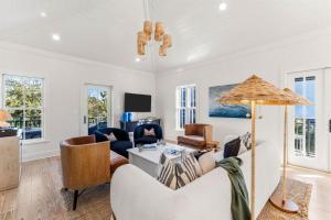 a living room with a couch and a table at The Last Waltz in Seacrest