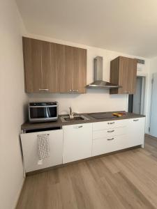 Η κουζίνα ή μικρή κουζίνα στο Comfortable and central short-term