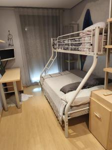 a bedroom with a bunk bed and a desk at CA PEPICA in Anna +61 photos