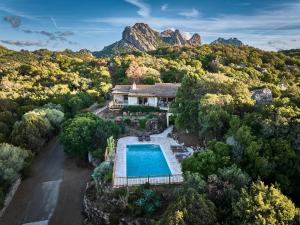 an aerial view of a house with a swimming pool at Cascioni Eco Retreat in Arzachena